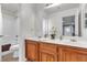 Bathroom with double vanity and a tub shower combo at 6513 Heavenly Moon St, North Las Vegas, NV 89084