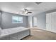 Main bedroom with gray walls and ceiling fan at 6513 Heavenly Moon St, North Las Vegas, NV 89084