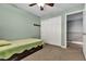 Cozy bedroom with light green walls and a ceiling fan at 6513 Heavenly Moon St, North Las Vegas, NV 89084