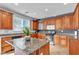 Modern kitchen with granite countertops and wood cabinetry at 6513 Heavenly Moon St, North Las Vegas, NV 89084