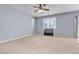 Main bedroom with ceiling fan and carpet at 6513 Heavenly Moon St, North Las Vegas, NV 89084