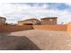 Spacious backyard featuring desert landscaping and block wall fencing for privacy and low maintenance at 658 Forest Peak St, Henderson, NV 89011
