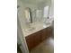 Bathroom with double sink vanity and a large mirror at 658 Forest Peak St, Henderson, NV 89011