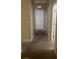 Carpeted hallway with neutral walls leading to several doors at 658 Forest Peak St, Henderson, NV 89011