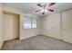 Bright bedroom with ceiling fan, window, and wall-to-wall carpeting at 6750 Del Rey Ave # 262, Las Vegas, NV 89146