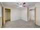 Spacious bedroom with ceiling fan and mirrored closet doors at 6750 Del Rey Ave # 262, Las Vegas, NV 89146