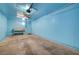 Spacious garage with light blue walls and ceiling fan at 6750 Del Rey Ave # 262, Las Vegas, NV 89146