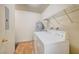 Laundry area with washer, dryer, and overhead shelving at 6750 Del Rey Ave # 262, Las Vegas, NV 89146