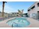 Kidney-shaped community pool and spa area at 6750 Del Rey Ave # 262, Las Vegas, NV 89146