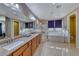 Elegant bathroom with granite countertops, soaking tub, and shower at 70 Portezza Dr, Henderson, NV 89011