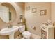 Charming powder room with pedestal sink and decorative accents at 70 Portezza Dr, Henderson, NV 89011