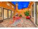 Private courtyard with fireplace and seating area at 70 Portezza Dr, Henderson, NV 89011