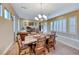 Elegant dining room featuring a rustic wood table and ample seating at 70 Portezza Dr, Henderson, NV 89011