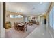 Bright dining room with rustic wood table and chairs at 70 Portezza Dr, Henderson, NV 89011