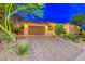 Brick paver driveway leads to a two-car garage in this beautiful home at 70 Portezza Dr, Henderson, NV 89011