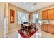 Bright kitchen with wood cabinets, granite countertops, and an island at 70 Portezza Dr, Henderson, NV 89011