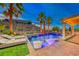 Luxury pool with spa and outdoor entertaining area at 70 Portezza Dr, Henderson, NV 89011