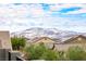 Aerial view showcasing homes with solar panels and mountain backdrop at 7306 Puckershire St, Las Vegas, NV 89166