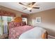 Serene bedroom with wooden bed frame and window coverings at 7306 Puckershire St, Las Vegas, NV 89166