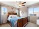 Charming bedroom with wooden bed frame and natural light at 7306 Puckershire St, Las Vegas, NV 89166