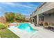 Stunning pool and spa with a large patio and seating area at 7306 Puckershire St, Las Vegas, NV 89166