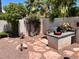 Outdoor kitchen area with built-in grill and stone path at 7456 Ute Meadows Cir, Las Vegas, NV 89129