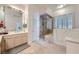 Primary bathroom boasts a walk-in shower and a large vanity at 7456 Ute Meadows Cir, Las Vegas, NV 89129