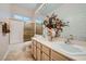 Guest bathroom with a shower/tub combo and double vanity at 7456 Ute Meadows Cir, Las Vegas, NV 89129