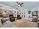 Bright living room featuring ample seating and high ceilings at 7456 Ute Meadows Cir, Las Vegas, NV 89129