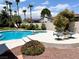 Inviting pool and spa with patio seating at 7456 Ute Meadows Cir, Las Vegas, NV 89129