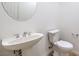 Clean powder room with pedestal sink and updated toilet at 7525 Royal Crystal St, Las Vegas, NV 89149