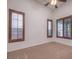 Spacious bedroom with carpet flooring and large windows at 7525 Royal Crystal St, Las Vegas, NV 89149