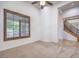 Bright and airy living room with carpet flooring and large windows at 7525 Royal Crystal St, Las Vegas, NV 89149