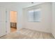 Bedroom with carpet, window blinds, and view of bathroom at 8031 Tank Loop St, Las Vegas, NV 89166