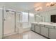 Main bathroom with double vanity, shower, and bathtub at 8031 Tank Loop St, Las Vegas, NV 89166