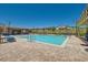 Community pool with lounge chairs and pergola at 8031 Tank Loop St, Las Vegas, NV 89166