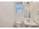 Clean powder room with pedestal sink and toilet at 8031 Tank Loop St, Las Vegas, NV 89166