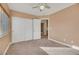 Bedroom with carpet, neutral walls, and double doors at 8220 Fawn Heather Ct, Las Vegas, NV 89149