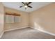 Well-lit bedroom with window and ceiling fan at 8220 Fawn Heather Ct, Las Vegas, NV 89149