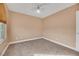 Bright bedroom featuring a ceiling fan and carpet at 8220 Fawn Heather Ct, Las Vegas, NV 89149