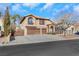 Two-story house with three-car garage and mature trees at 8220 Fawn Heather Ct, Las Vegas, NV 89149