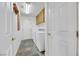 Bright laundry room with washer, dryer, and ample storage at 8220 Fawn Heather Ct, Las Vegas, NV 89149