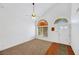 Bright living room with vaulted ceiling, carpet, and wood flooring at 8220 Fawn Heather Ct, Las Vegas, NV 89149