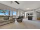 Open-concept living room flowing into the kitchen, featuring neutral tones and a comfortable seating area at 840 Picotte St # 101, Las Vegas, NV 89144