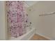 Clean bathroom with shower/tub combo and floral shower curtain at 8777 W Maule Ave # 1094, Las Vegas, NV 89148