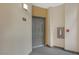 Apartment entry with gray door and fire extinguisher at 8777 W Maule Ave # 1094, Las Vegas, NV 89148