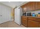 Kitchen with white appliances and wood cabinets at 8777 W Maule Ave # 1094, Las Vegas, NV 89148