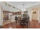 Kitchen with wood cabinets, round table and chairs at 8777 W Maule Ave # 1094, Las Vegas, NV 89148