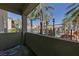 Private patio overlooking the community pool and palm trees at 8777 W Maule Ave # 1094, Las Vegas, NV 89148