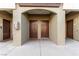 Two brown doors with an arched entryway and light colored walls at 9000 Las Vegas Blvd # 2243, Las Vegas, NV 89123